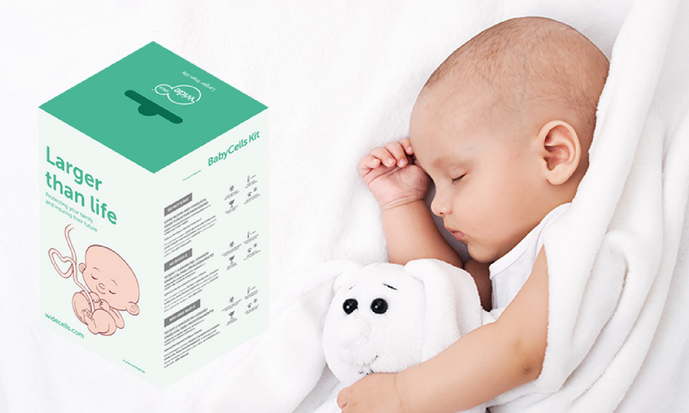 Baby cuddling a toy next to a stem cell box