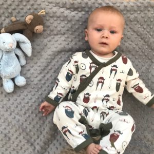 Baby wearing Pigeon Organic Romper