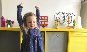My daughter celebrating reward chart success