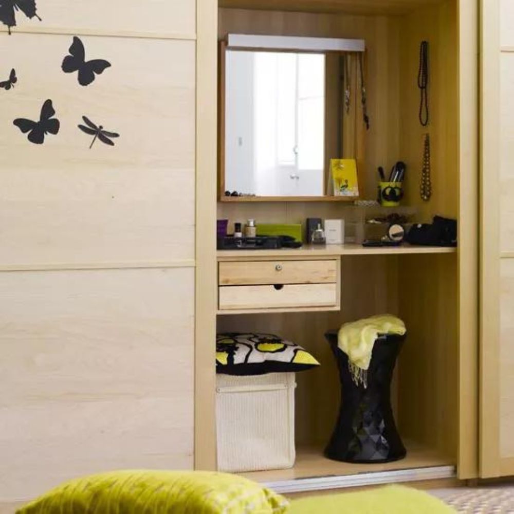 Add a desk or dressing table to the corner of the room or even hide it in the sliding wardrobe. 